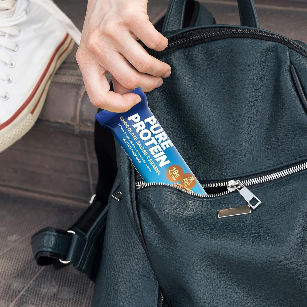 On-the-go Pure Protein Bar in gym bag for pre- or post-workout fueling