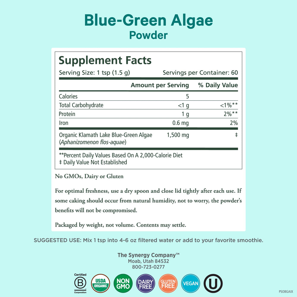 Measuring scoop of PURE SYNERGY Blue-Green Algae powder in glass