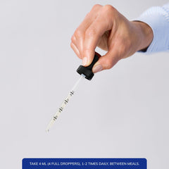 Pouring Pure Tranquility Liquid into a dropper