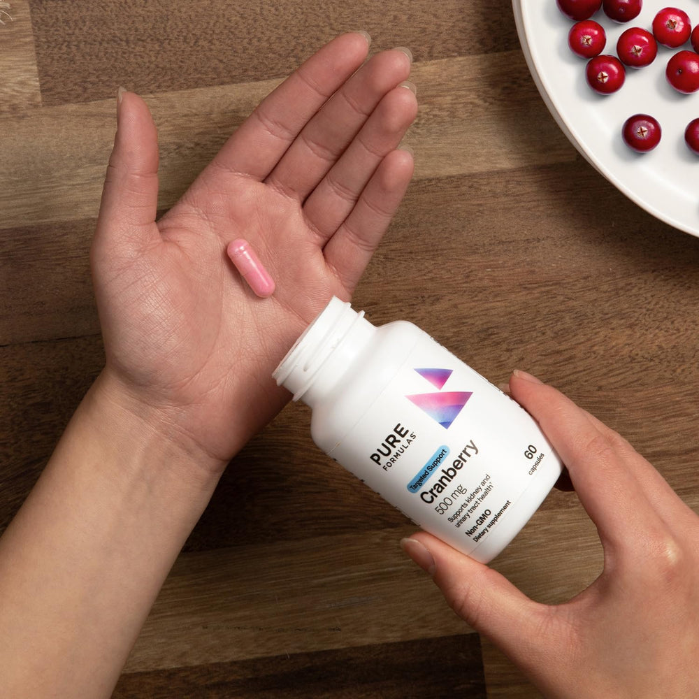 Cranberry capsules with health-focused imagery illustrating urinary tract health