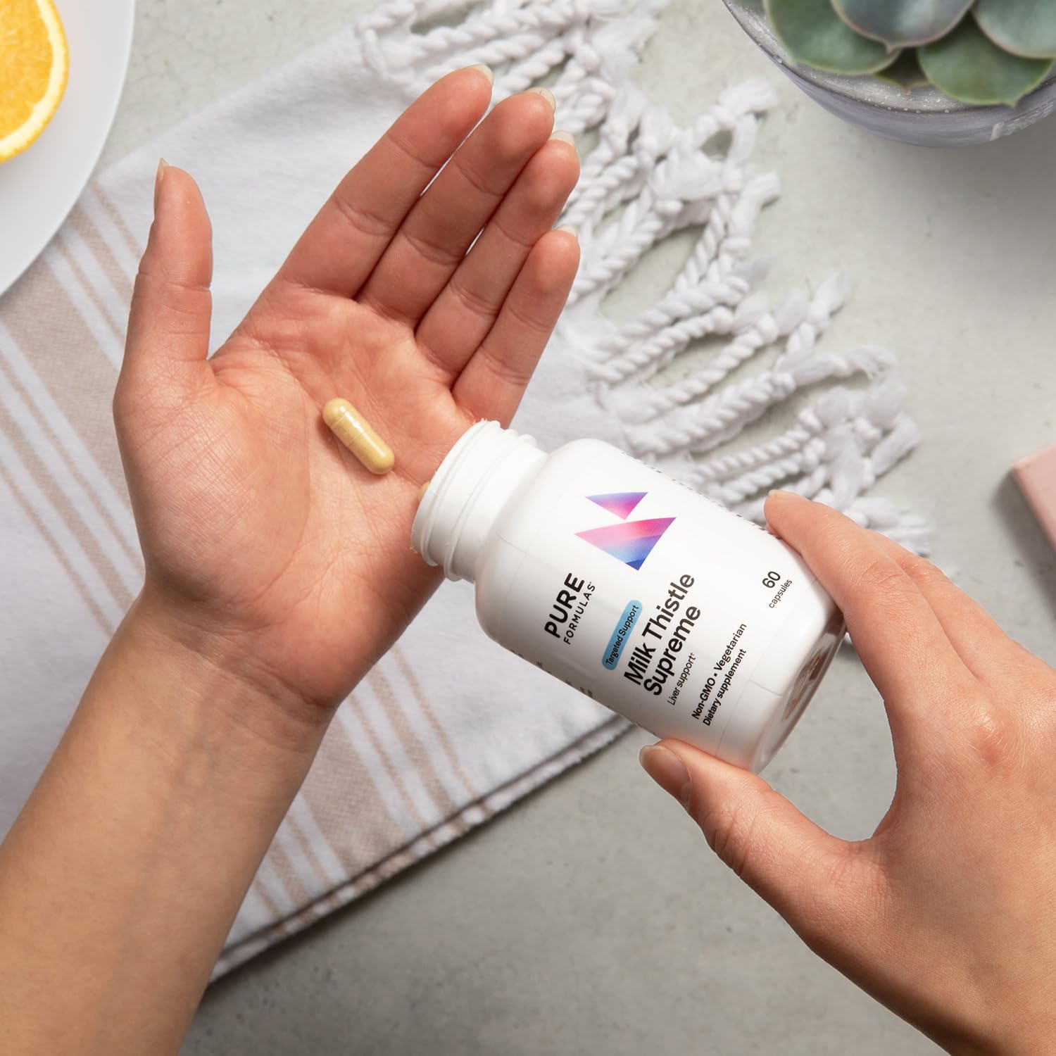 PureFormulas packaging with GMP seal emphasizing certified quality control