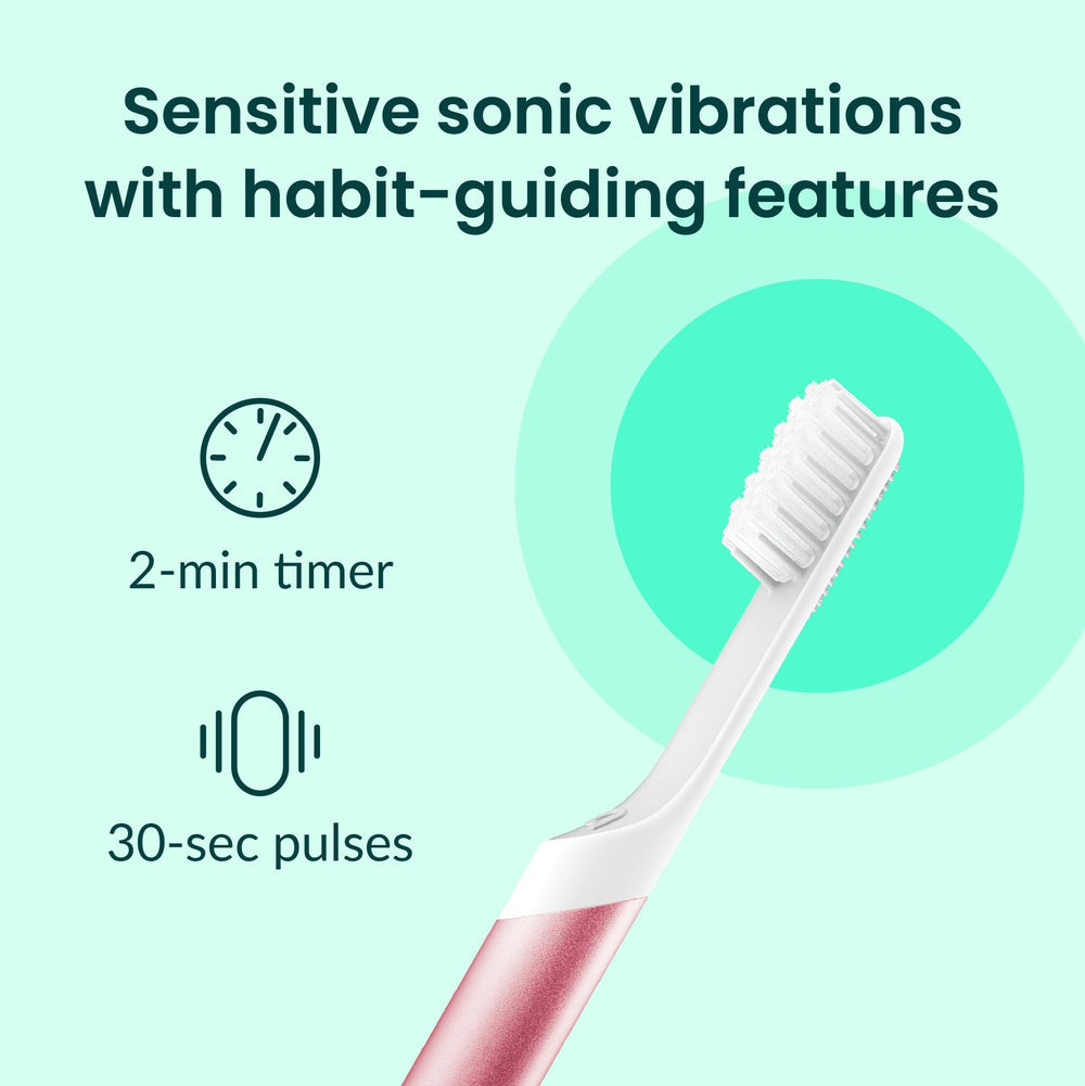 Quip toothbrush in pink with cover attached
