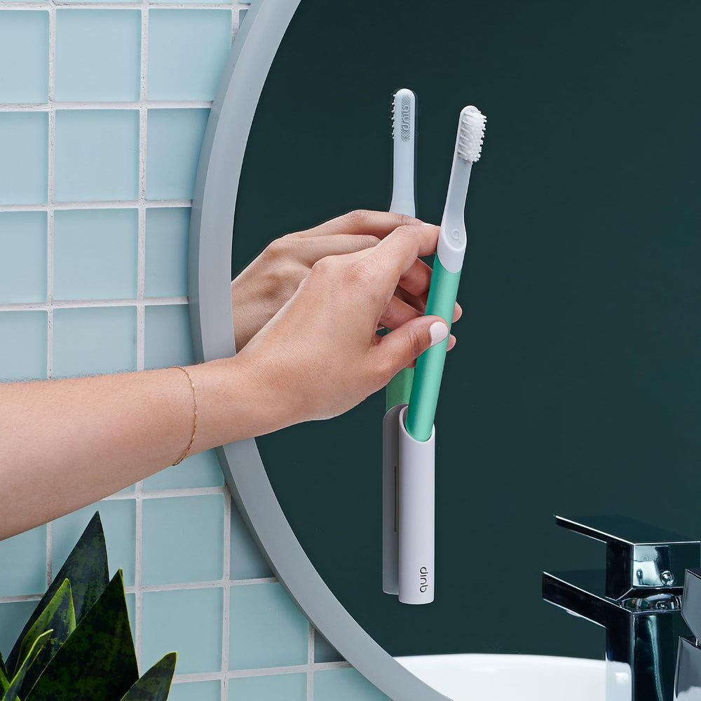 Quip travel toothbrush with accessories and packaging
