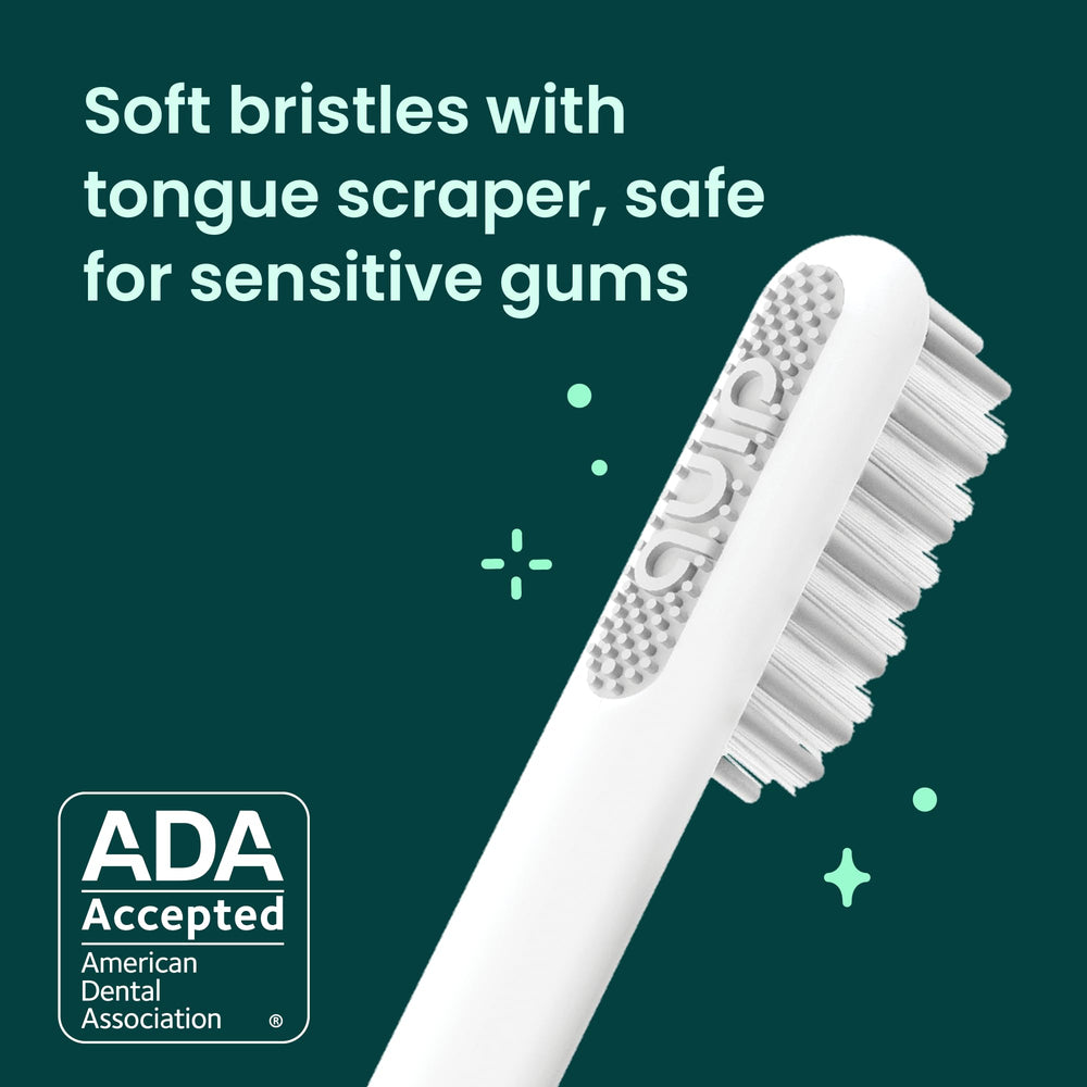 Magenta quip toothbrush showing timer feature