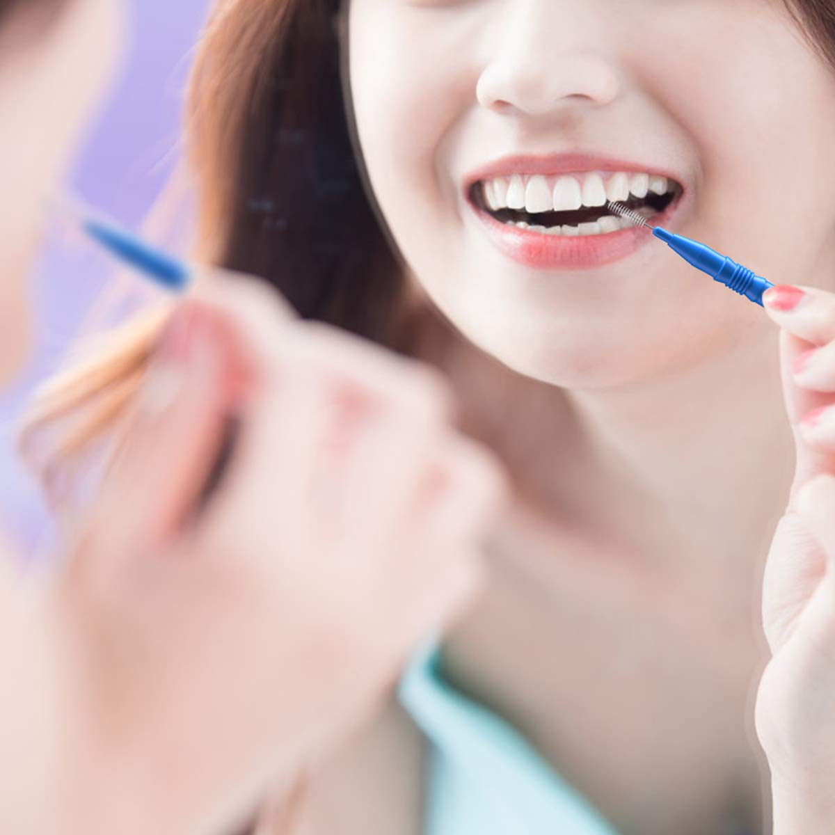 Using an interdental brush to clean between teeth