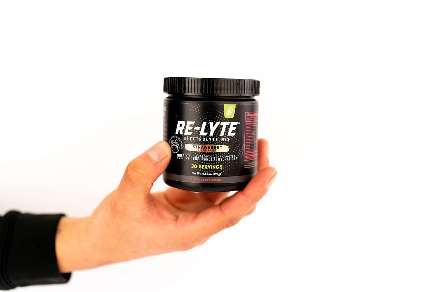Re-lyte Strawberry Lemonade powder dissolves quickly in cold water for post-workout hydration ritual.
