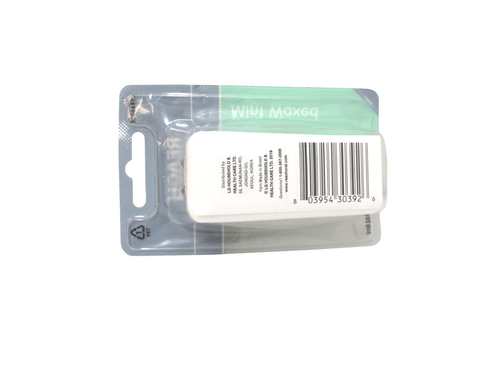 Two compact floss dispensers with mint-flavored waxed floss