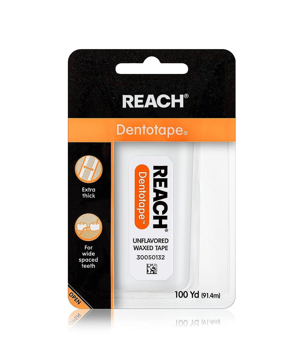 Close-up of Reach Dentotape dental floss showing the waxed coating for easy sliding between teeth