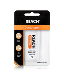 Close-up of Reach Dentotape dental floss showing the waxed coating for easy sliding between teeth