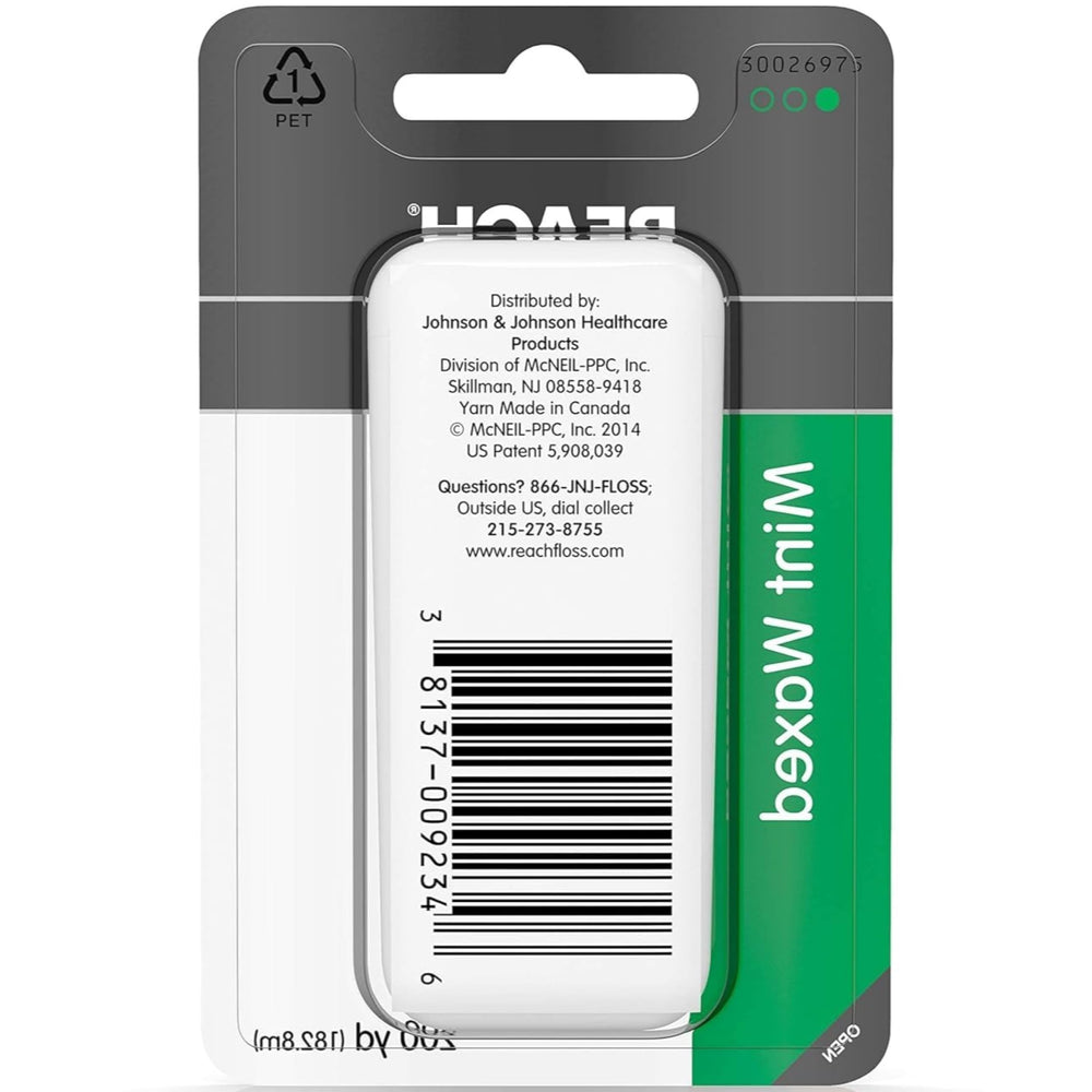 Floss being used between teeth showing mint flavor