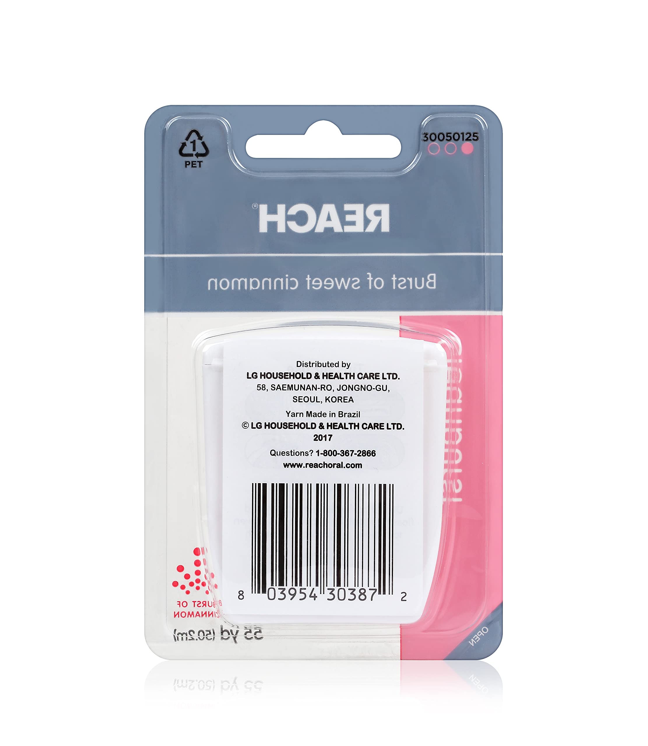 Flossing between teeth with Reach Cleanburst Cinnamon waxed floss