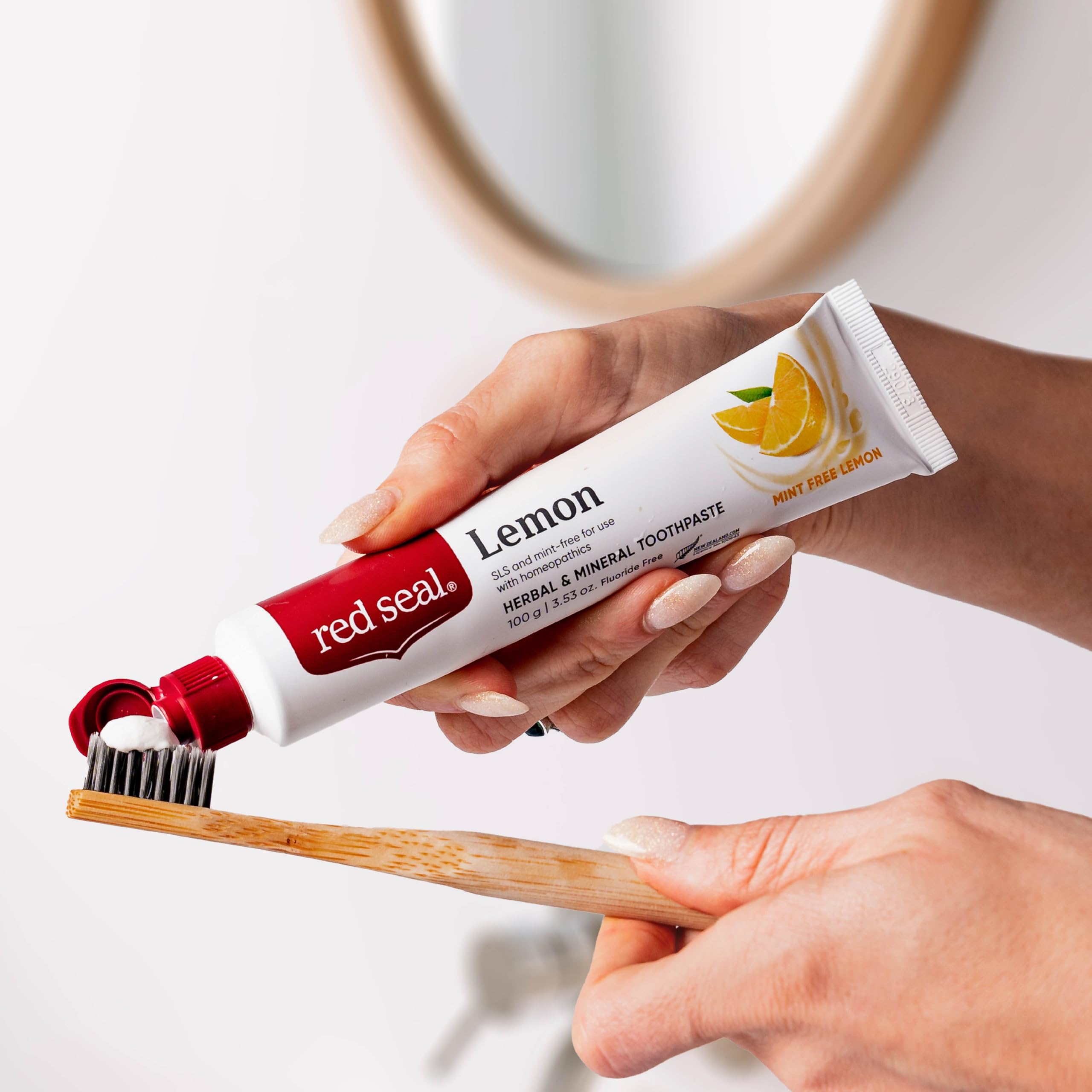 Creamy lemon toothpaste texture on a spoon
