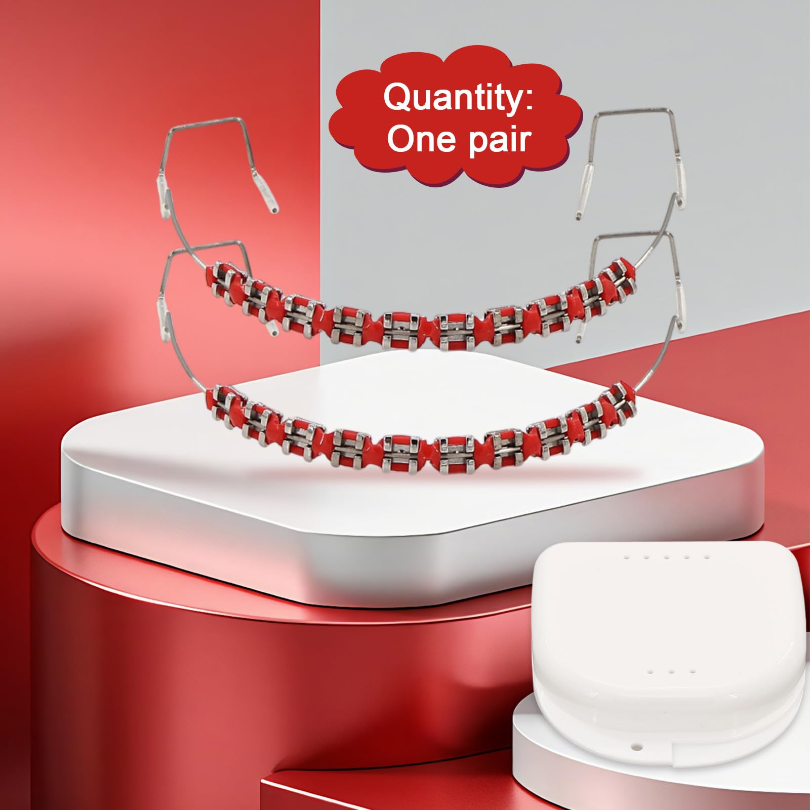 Close-up of metal brackets and orthodontic ligature ties in red