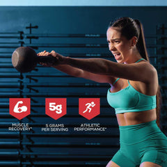 Serving scoop of creatine monohydrate powder with water