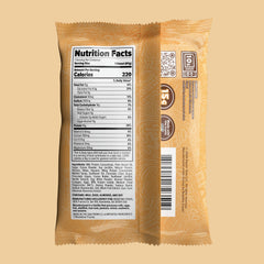 REDEFINE protein donut cross-section reveals creamy dough bits and cookie chips.