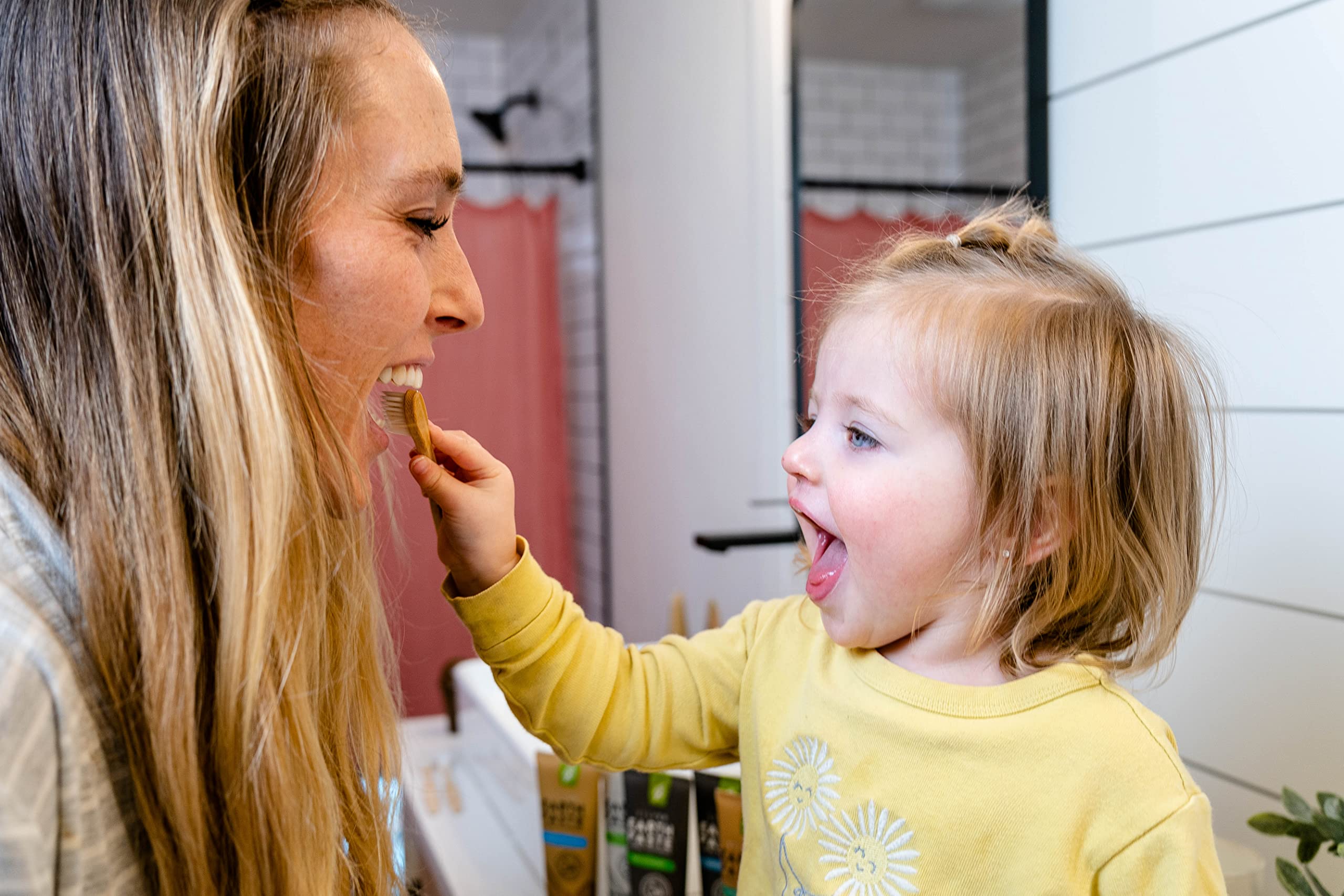 Toothpaste being dispensed onto a toothbrush