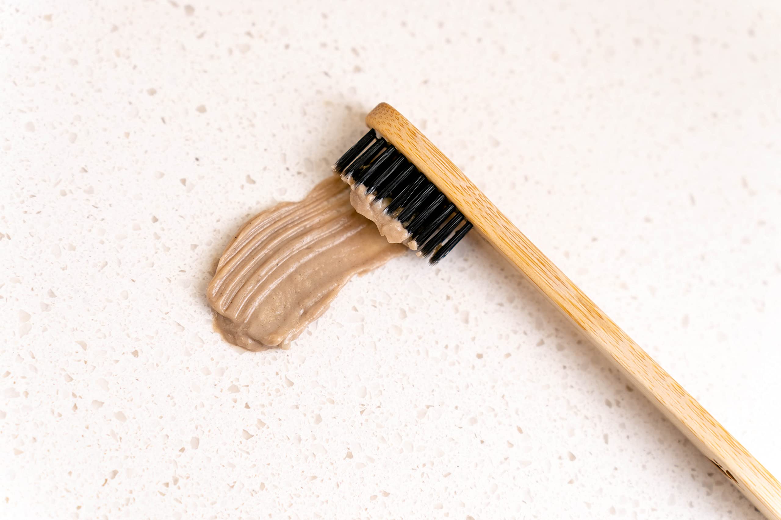 Serving suggestion with toothpaste tube and a small dish