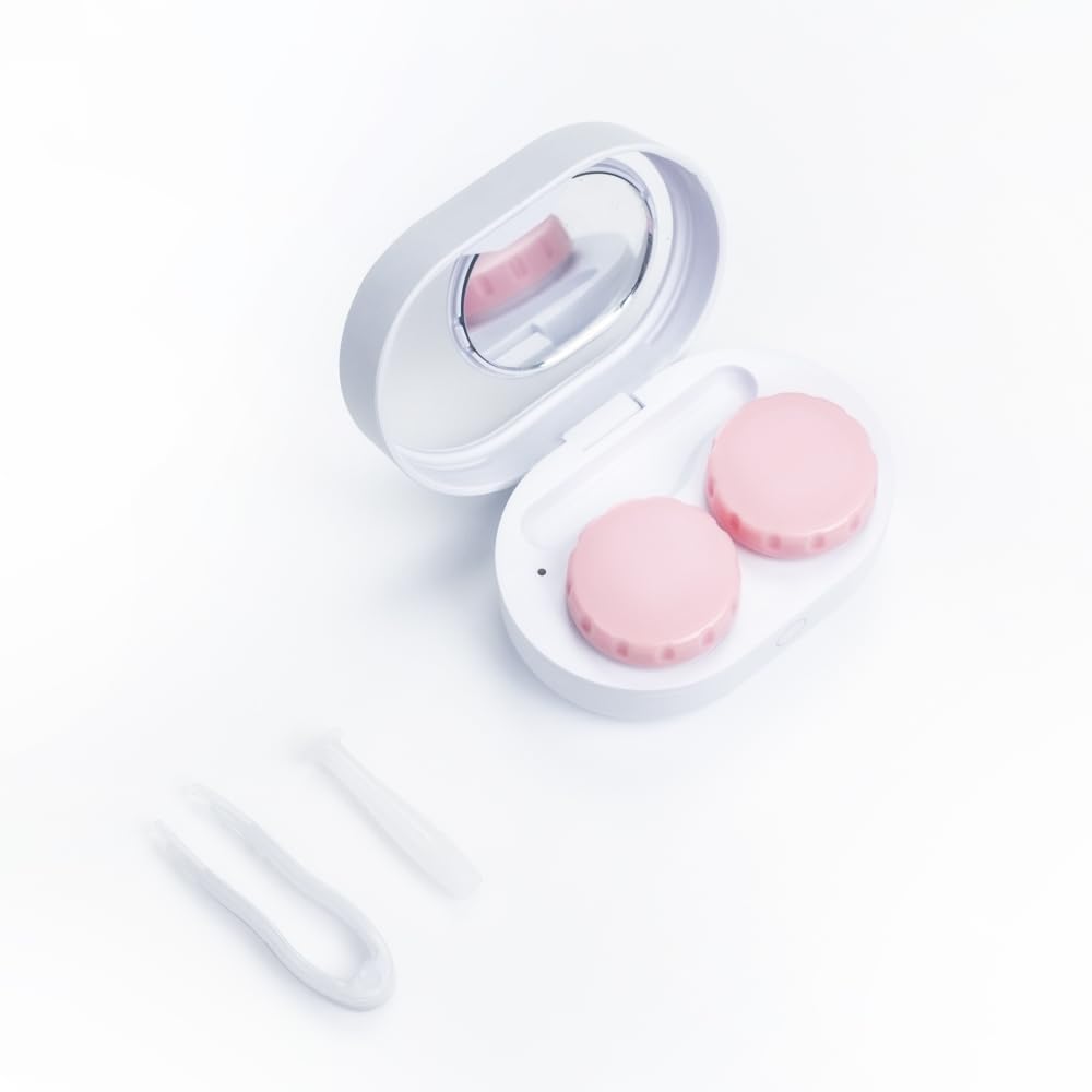 Close-up of compact mirror and tweezers included with ReO2 Mini Pro