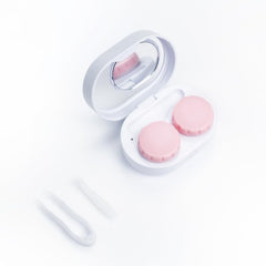 Close-up of compact mirror and tweezers included with ReO2 Mini Pro