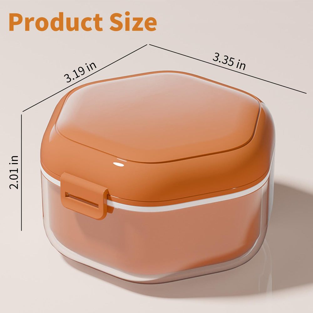 Interior of orange denture case with storage layer