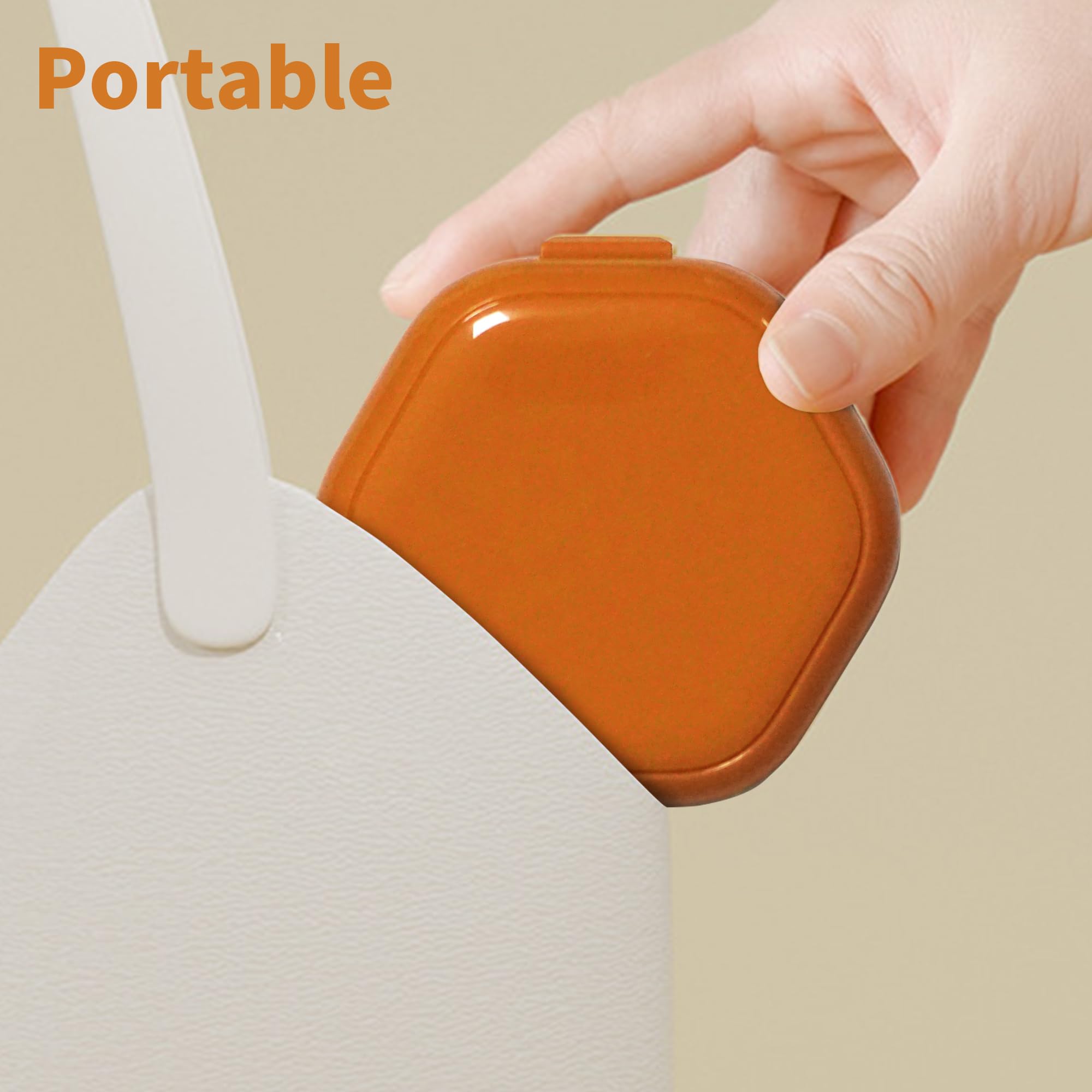 Compact travel-friendly orange denture case