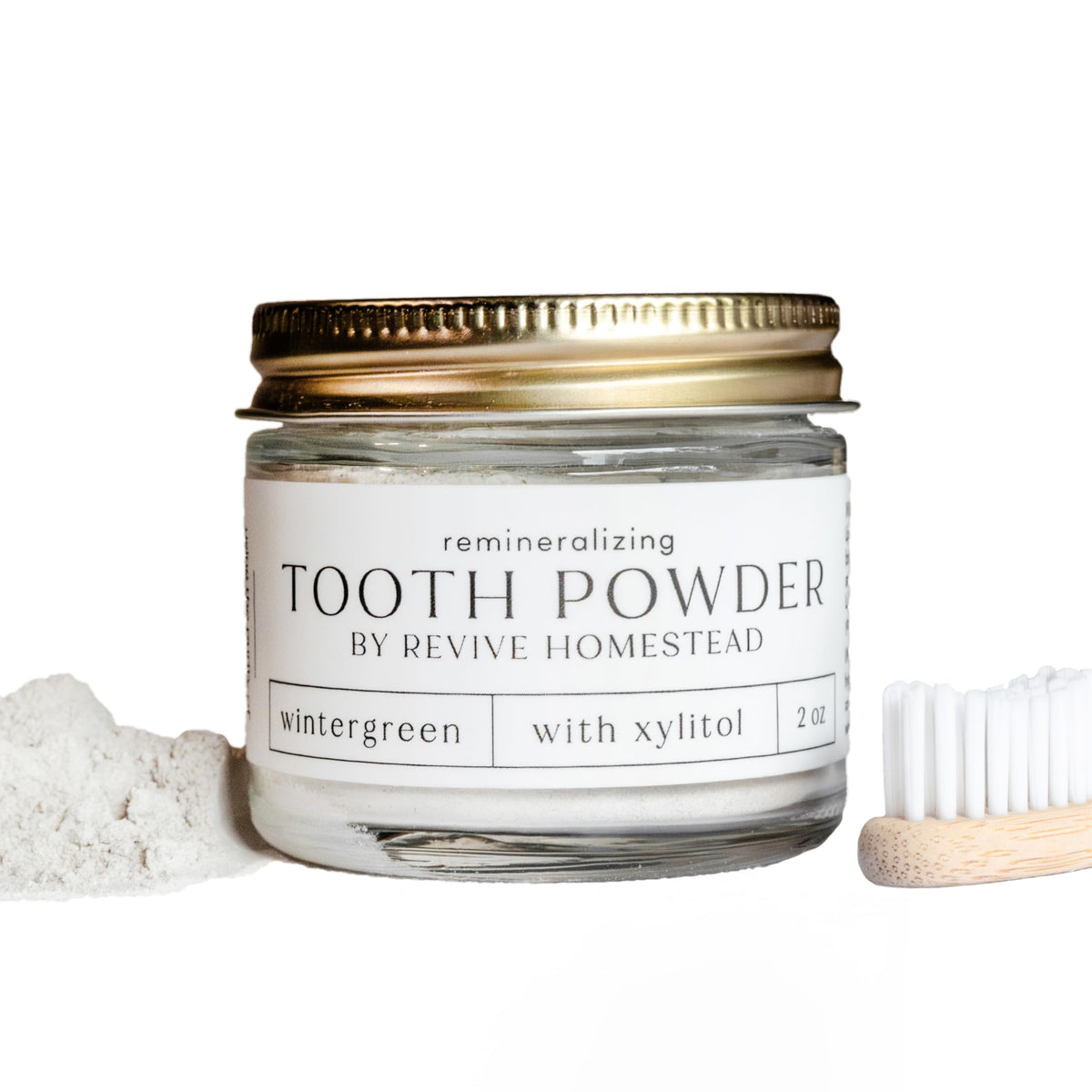 Amber glass jar of Revive Homestead Hydroxyapatite Tooth Powder