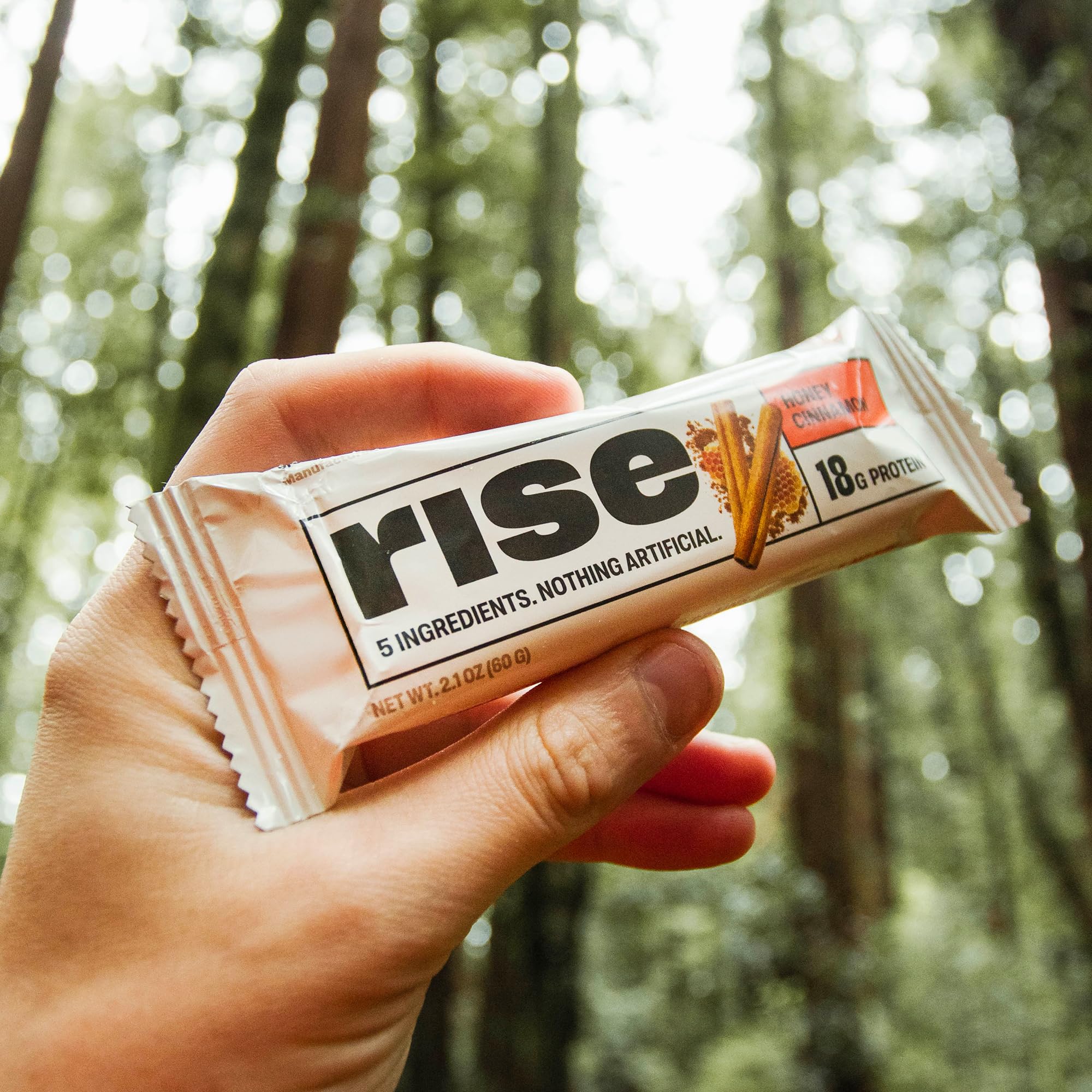 Rise Whey Bars Honey Cinnamon with cup of coffee on a breakfast table