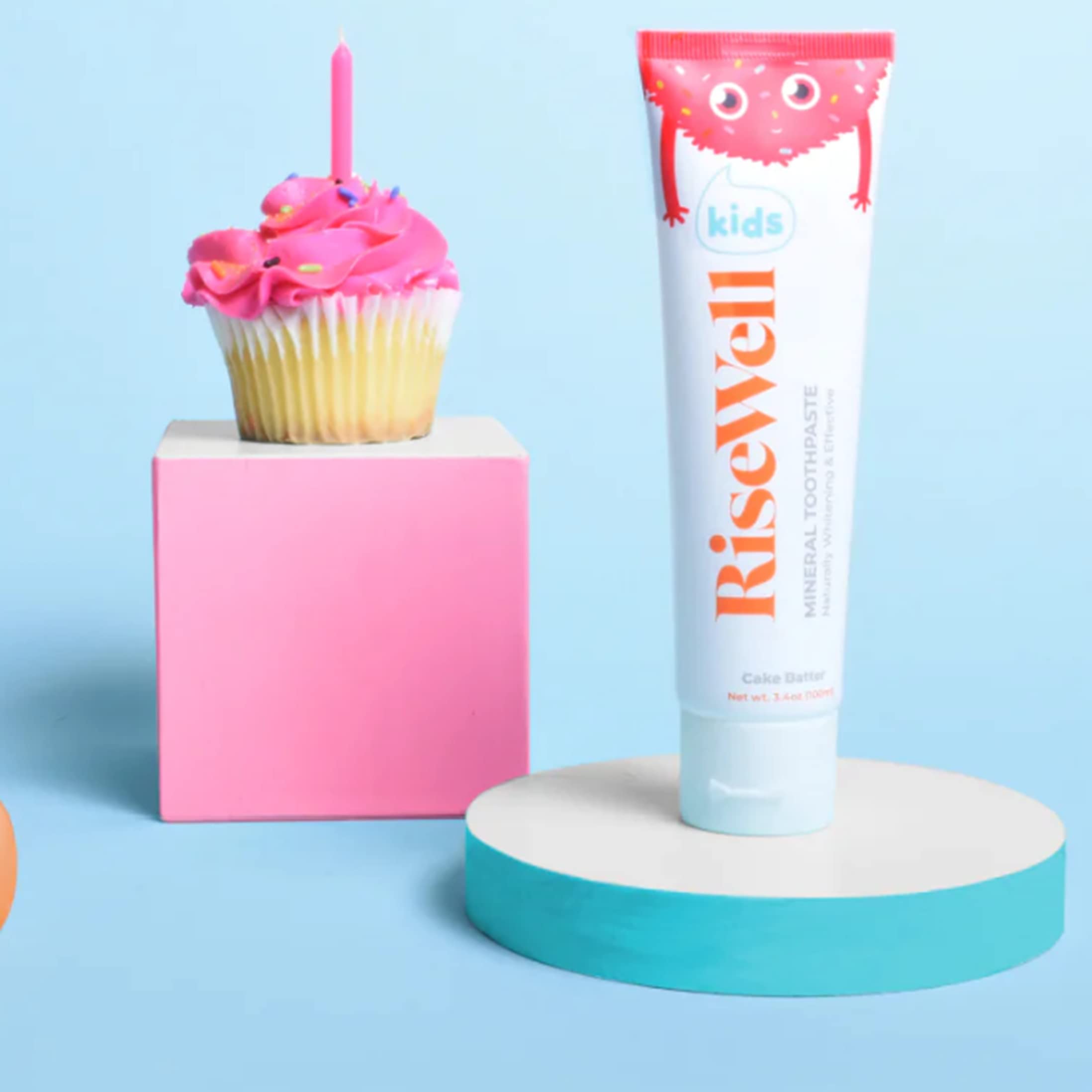 Child brushing teeth with RiseWell Cake Batter toothpaste