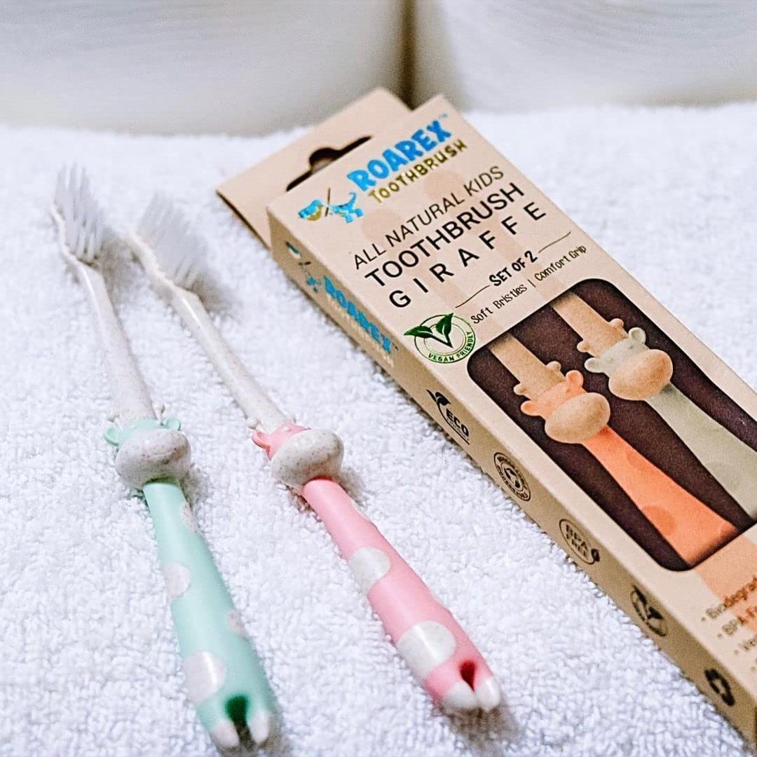 Dinosaur/giraffe-inspired design to make brushing fun for kids