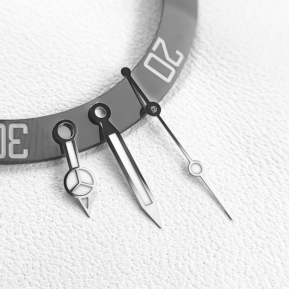 Close-up of hour, minute and sweep second hands in silver
