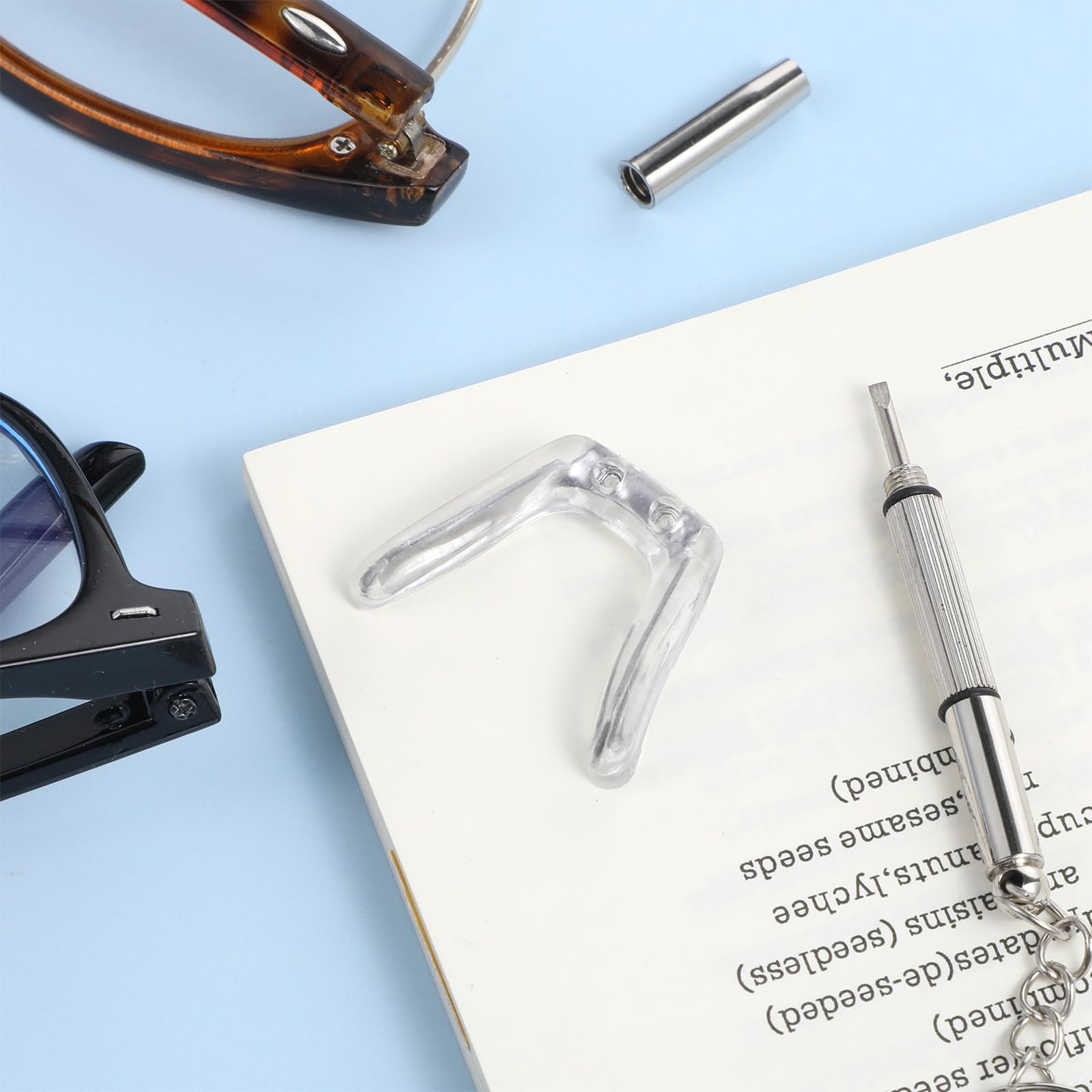 Metal-framed glasses showing silicone nose pad replacement
