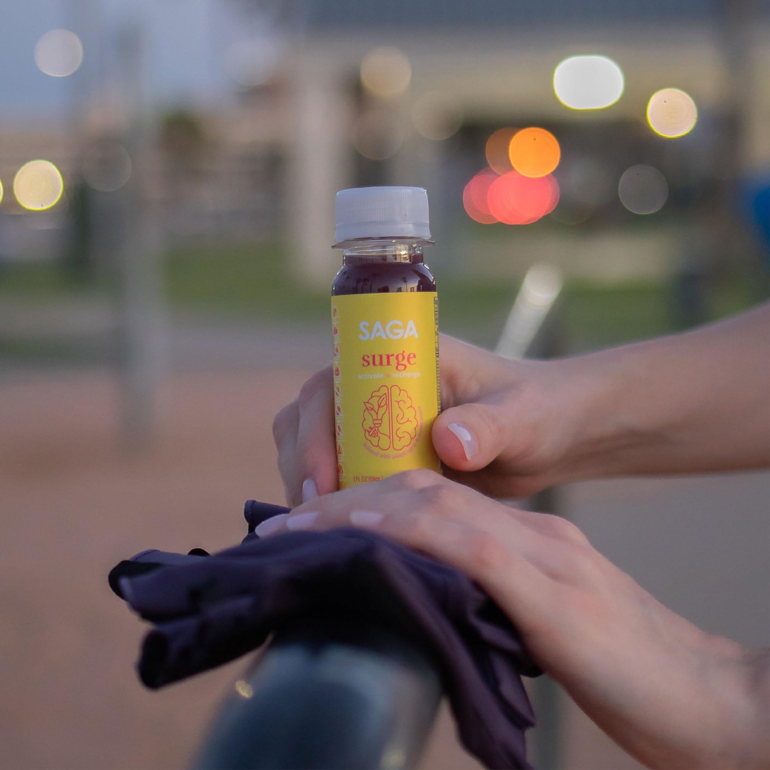 SAGA Surge Peach Mango 2oz energy shot bottle – close-up label