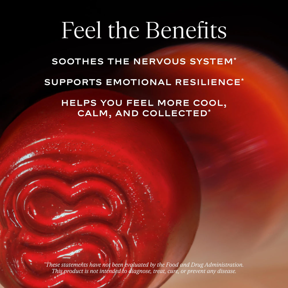 Open bottle with gummies spilling onto white surface