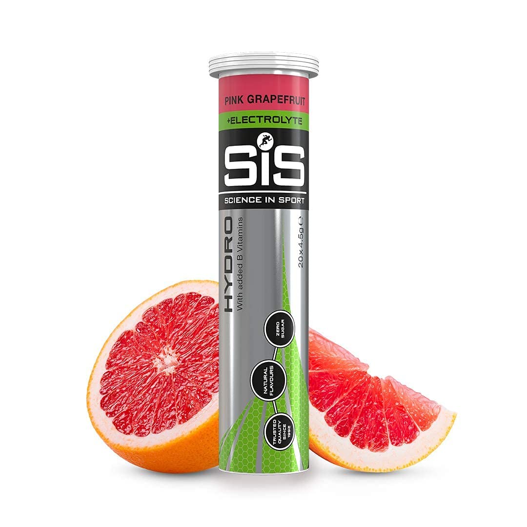 Science in Sport hydro electrolyte pink grapefruit tablet with water in a glass