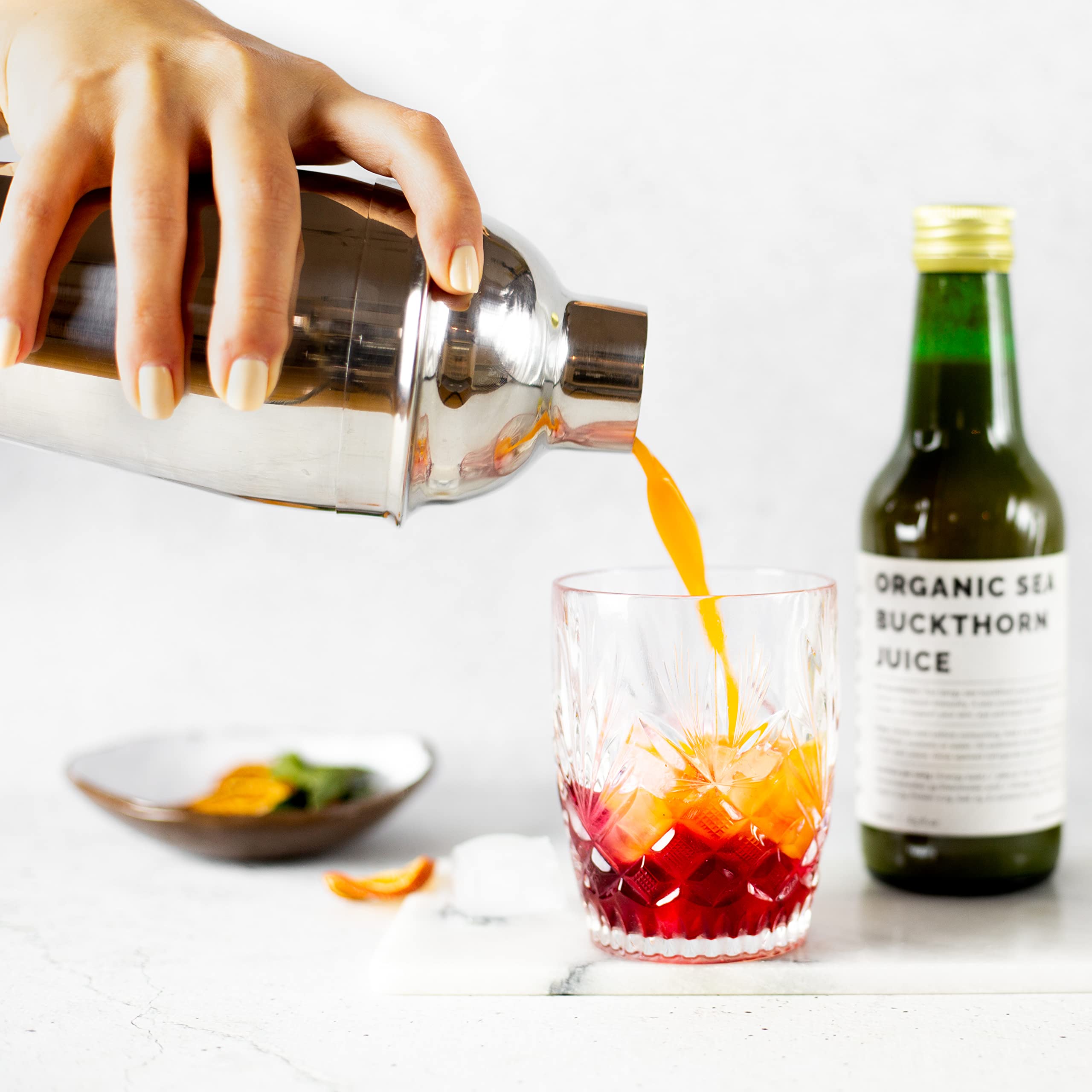 Close-up of sea buckthorn juice bottle showing label and cap