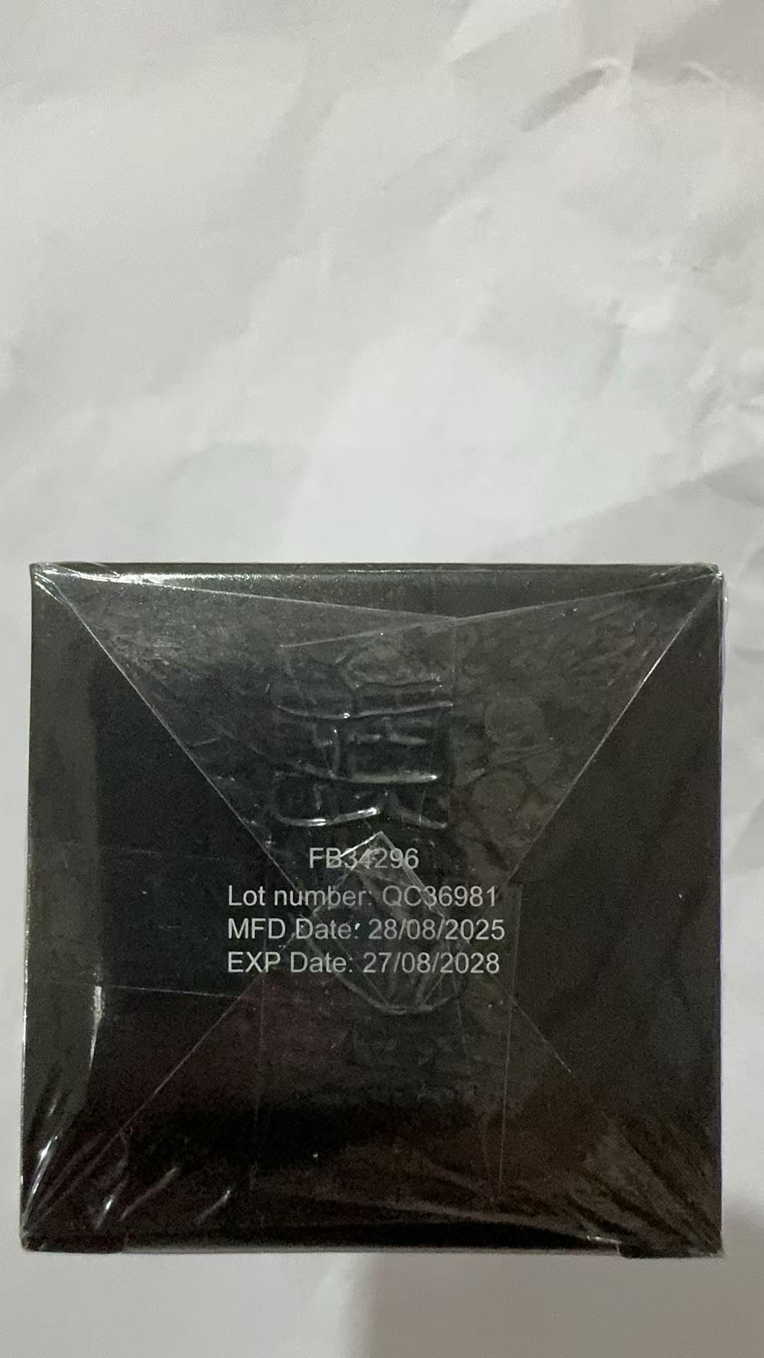 Product packaging and seal on a glossy bottle