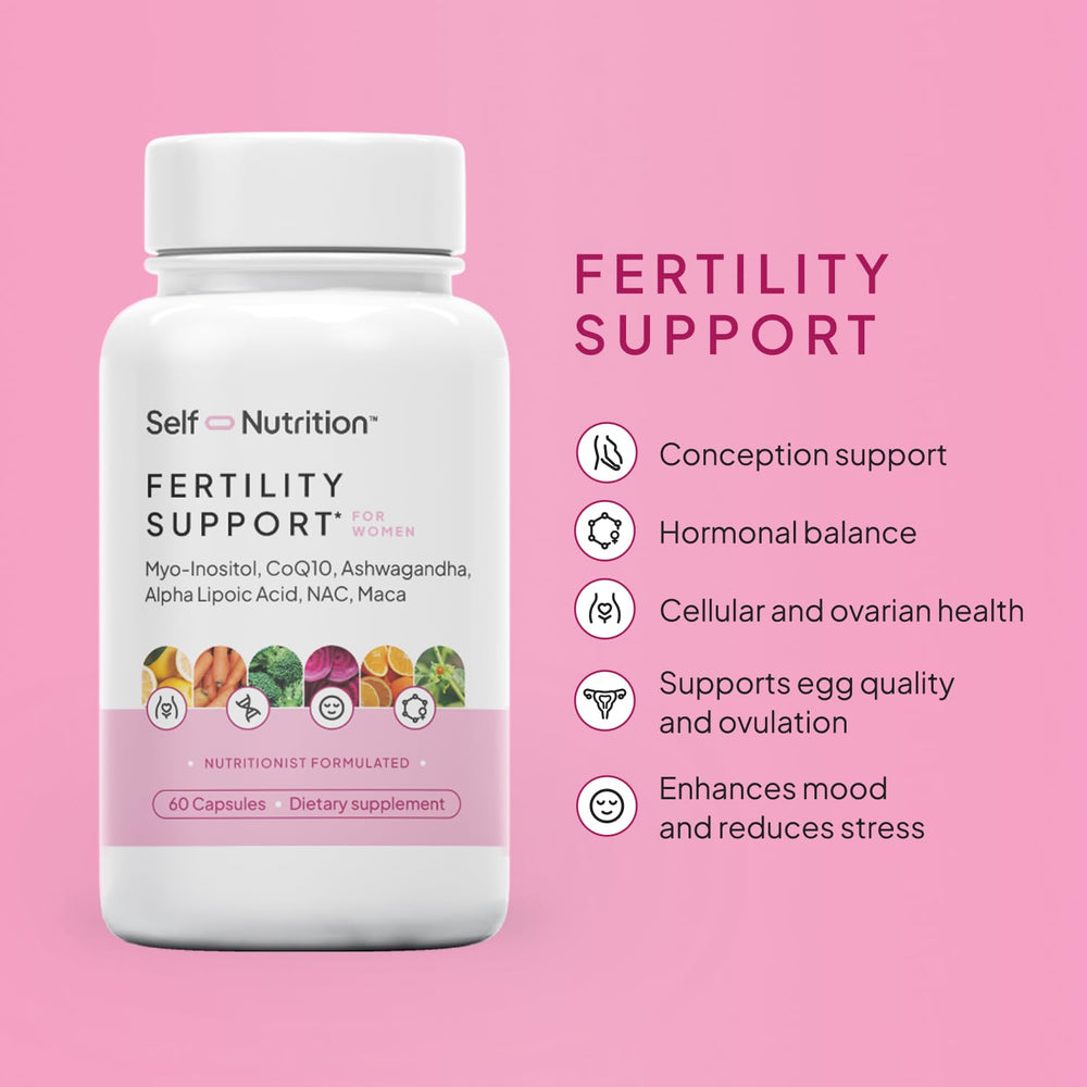 Woman reviewing a pregnancy planner and calendar