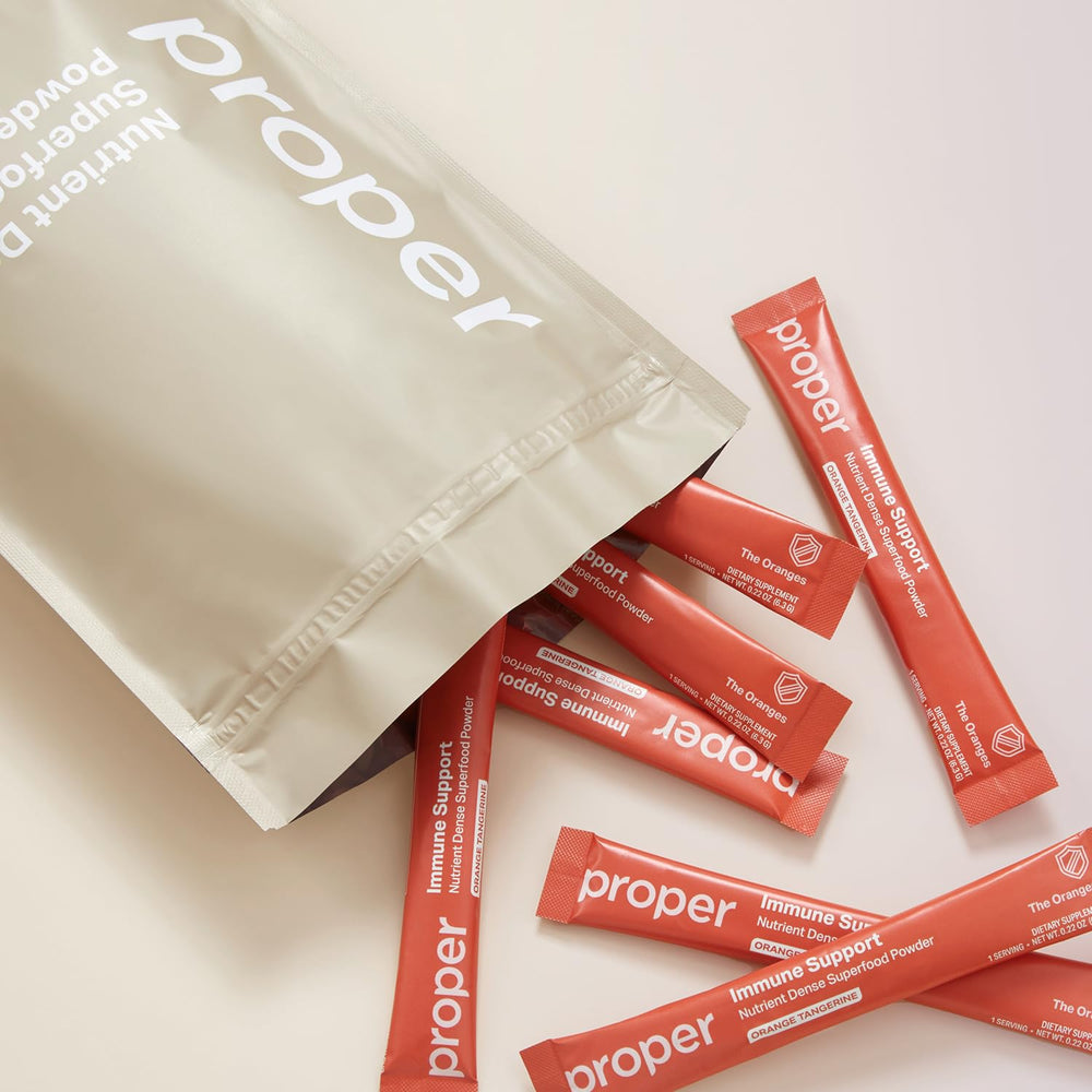 Container shows 15 servings of Proper Oranges Immune Support