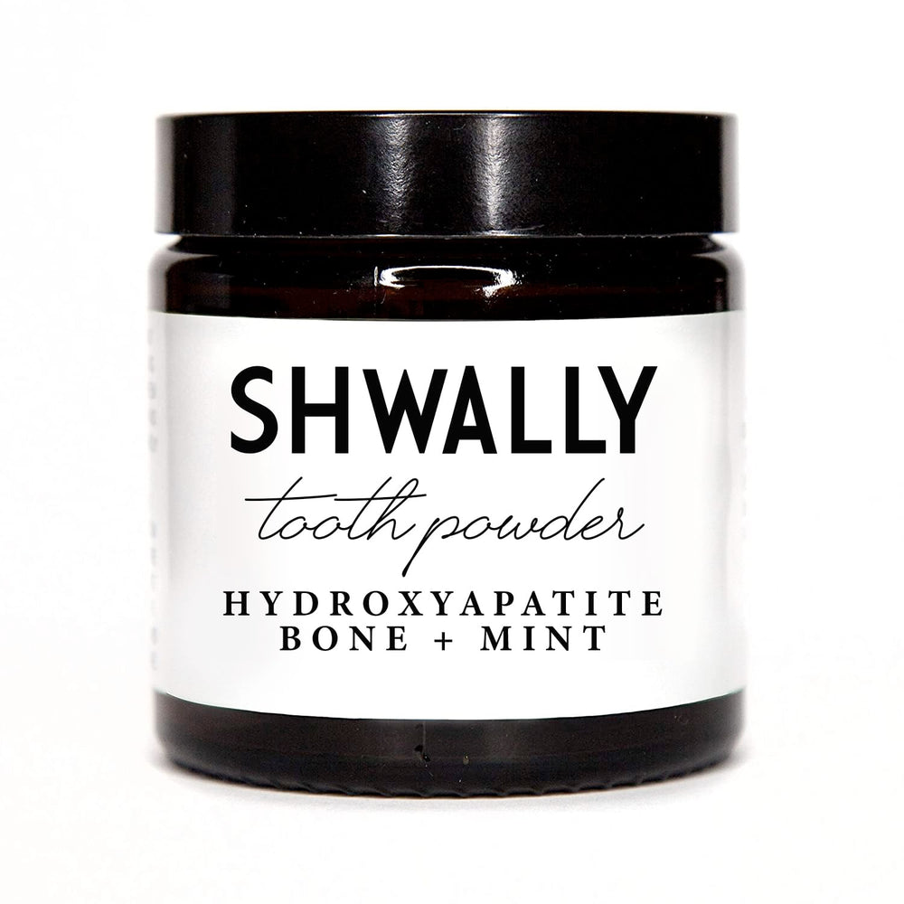 Shwally Tooth Powder bottle and label on a white background
