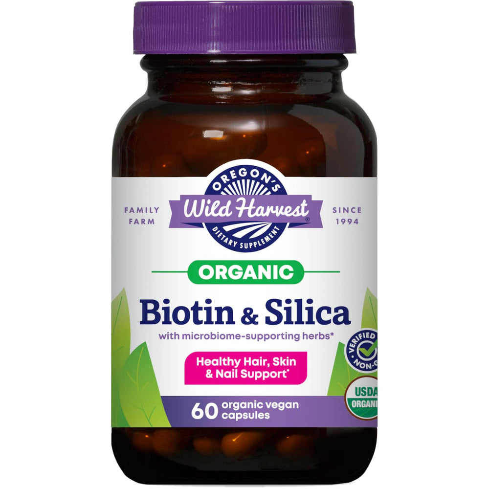 Silica & Biotin Capsules bottle on a wooden surface