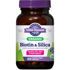 Silica & Biotin Capsules bottle on a wooden surface