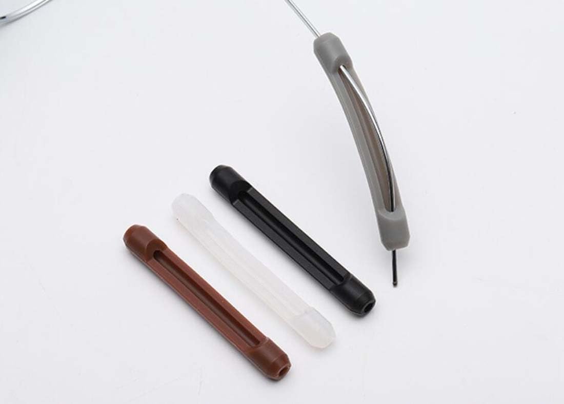 Glasses with silicone ear cushions attached to temple arms