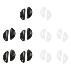 Silicone eyeglass nose pads attached to a frame in black and clear colors