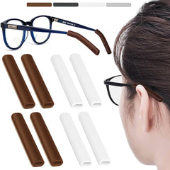 Four pairs of silicone glasses ear cushions in brown and white colors