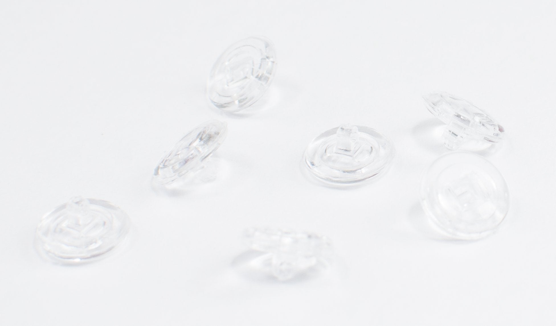 Close-up of round silicone nose pads for eyeglasses, 9mm screw-fit