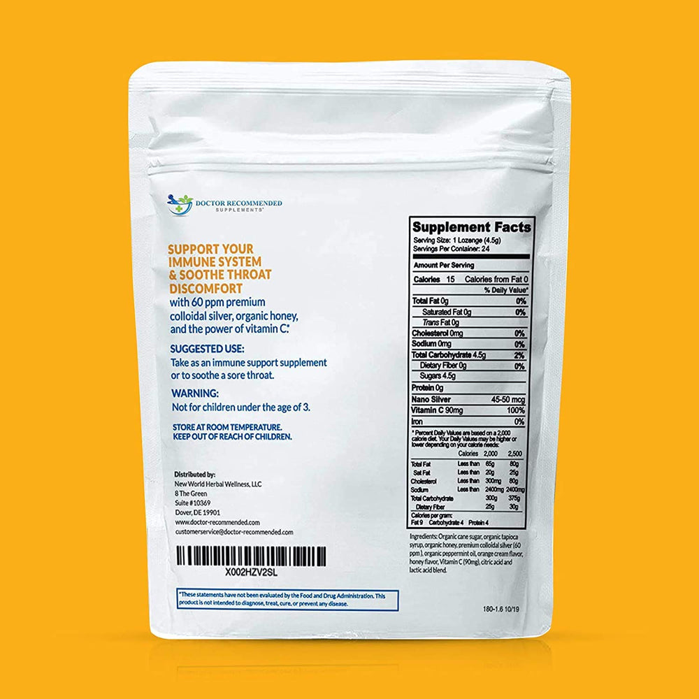 Close-up showing orange-flavored lozenge and ingredients