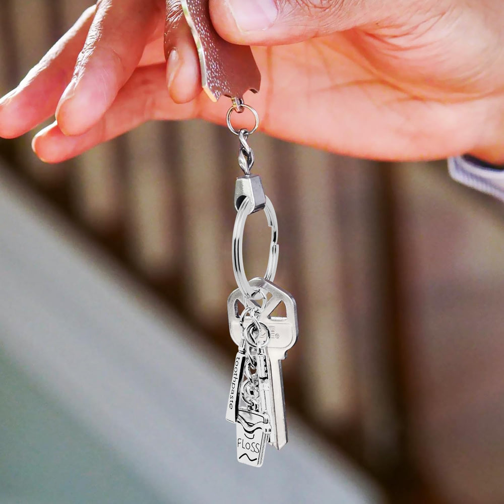Front view of silver alloy dental keychain with toothbrush charm