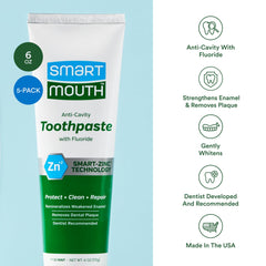 Toothpaste being squeezed onto a toothbrush
