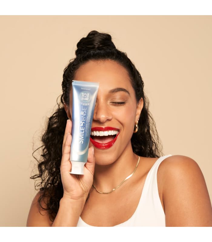 Person brushing teeth with SmileSense toothpaste for mint freshness
