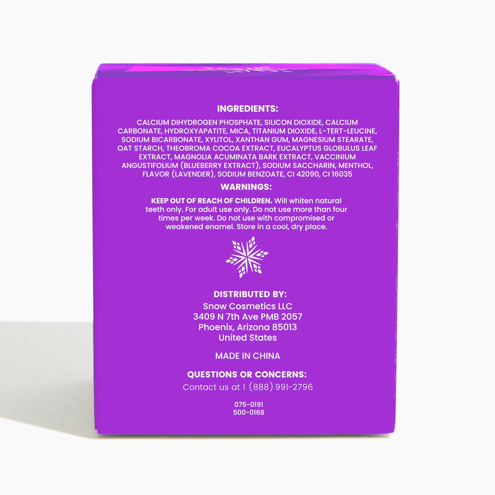 Close-up of SNOW Purple Magic Powder being sprinkled onto toothbrush